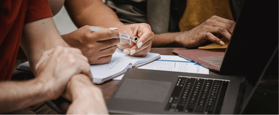 Investors and founders reviewing due diligence documents together